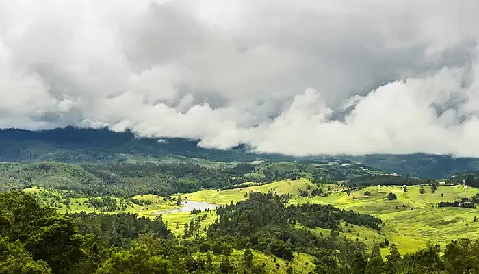 Mannavanur Lake under clouded sky